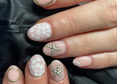 Elegant starfish nail art at Polish Me Pretty in Walkern, England, GB showcasing creativity and style.