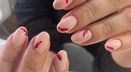 Elegant chili-themed nail art at Polish Me Pretty in Walkern, England, GB. Perfect for a bold, unique look.