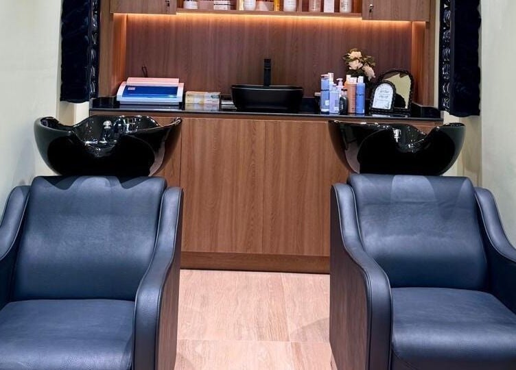 Modern wash stations at AZUL BEAUTY SALON-L.L.C, Abu Dhabi, Abu Dhabi, AE, featuring sleek chairs and shampoo sinks.