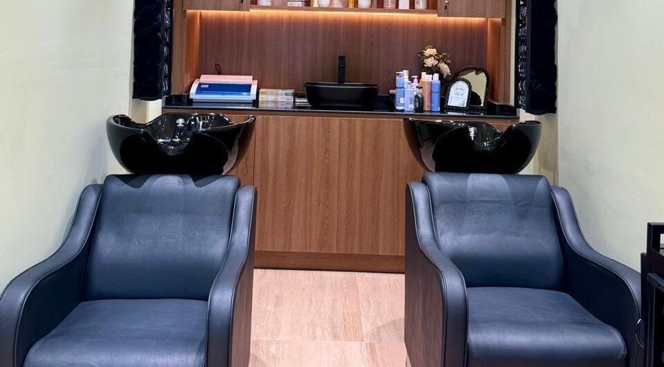 Modern wash stations at AZUL BEAUTY SALON-L.L.C, Abu Dhabi, Abu Dhabi, AE, featuring sleek chairs and shampoo sinks.