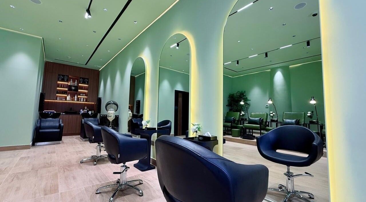 Stylish interior of AZUL BEAUTY SALON-L.L.C in Abu Dhabi, featuring modern chairs and decor.