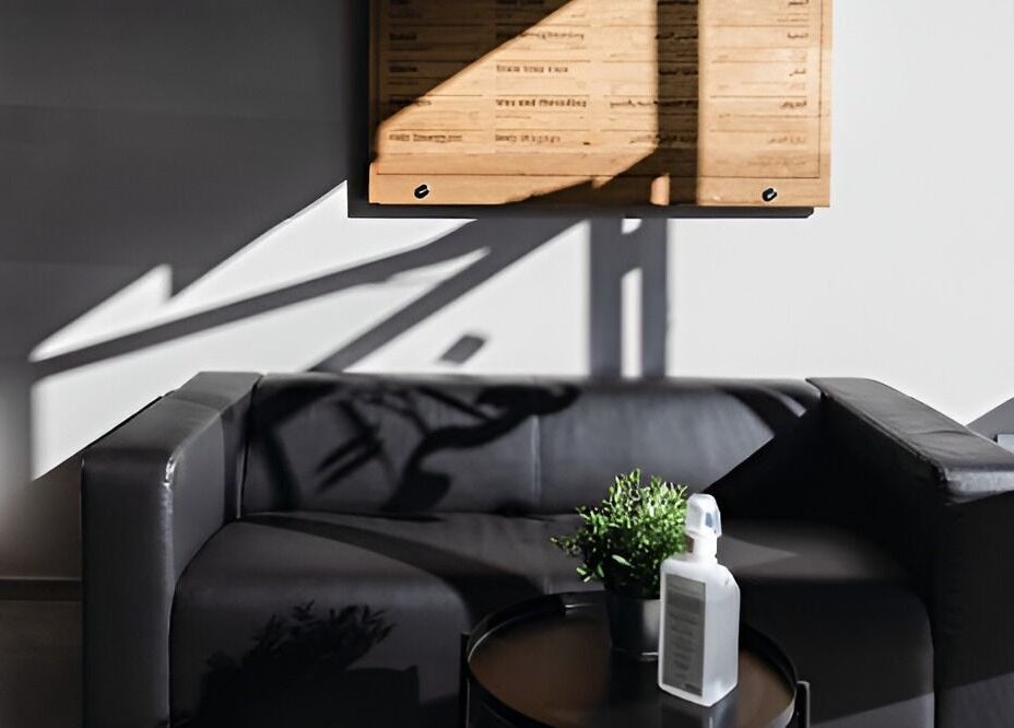 Modern lounge area at Yousef Afandi- Rabieh, Amman, Amman Governorate, JO with black sofa and decor.