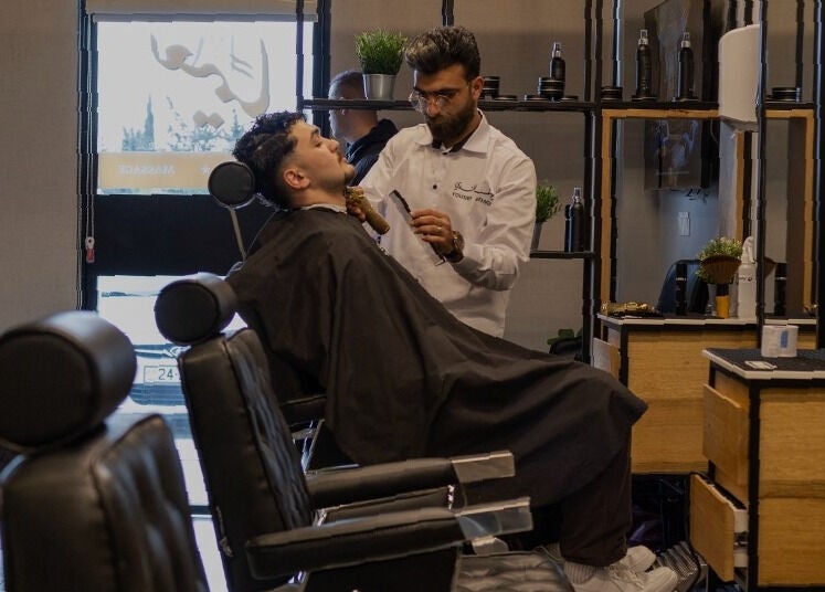 Professional barber grooming client at Yousef Afandi- Rabieh in Amman, Amman Governorate, JO.