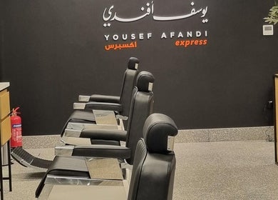 Luxurious interior of Yousef Afandi- Dabouk Bader Al Jadeedah in Amman, showcasing modern barber chairs.