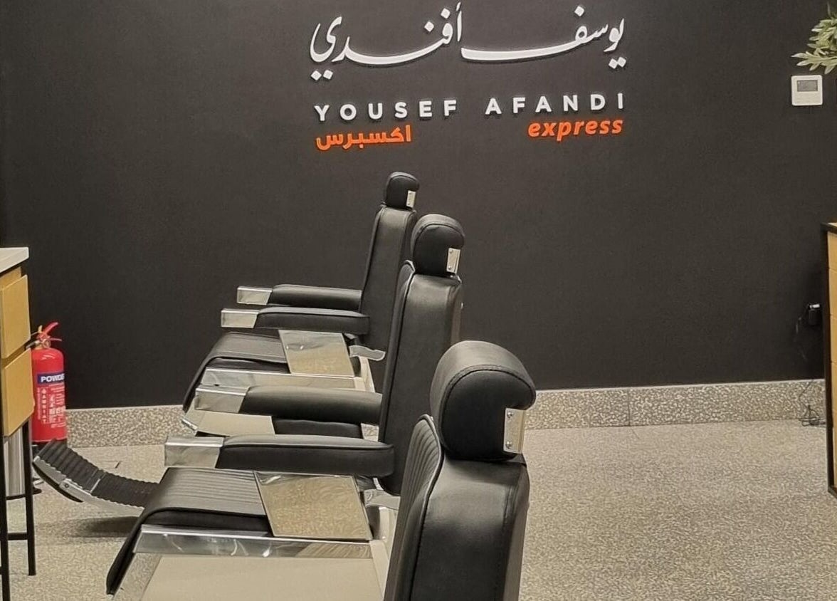 Luxurious interior of Yousef Afandi- Dabouk Bader Al Jadeedah in Amman, showcasing modern barber chairs.