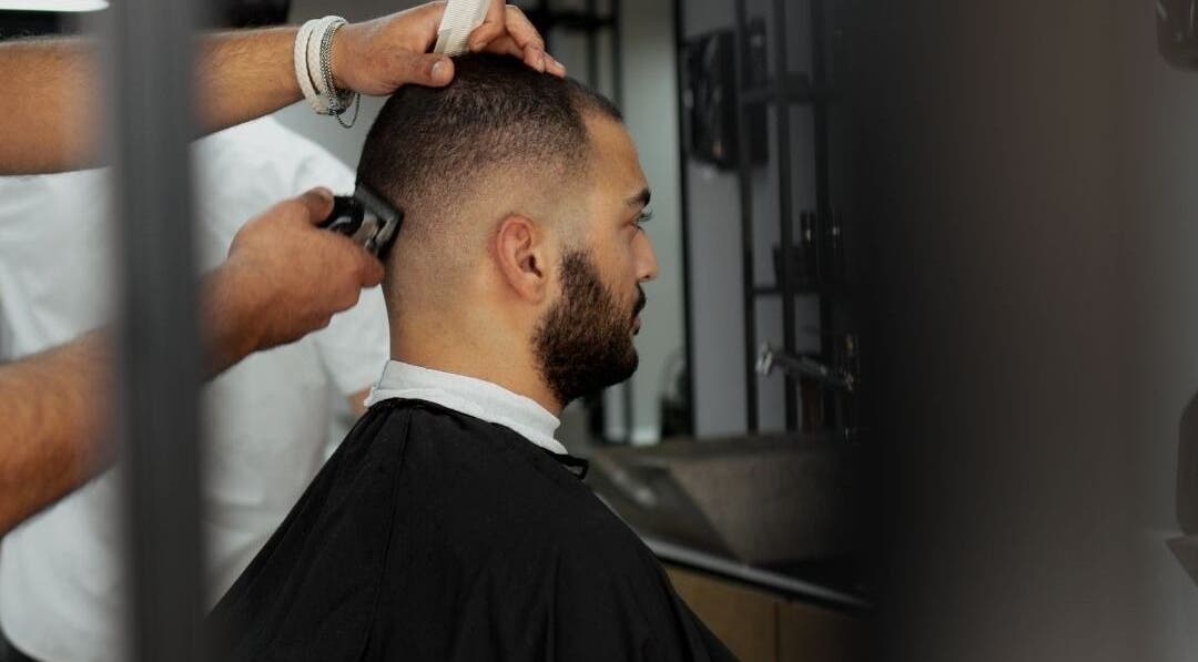 Man receiving trendy haircut at Yousef Afandi Express- Um Zwaitina in Amman, Amman Governorate, JO.