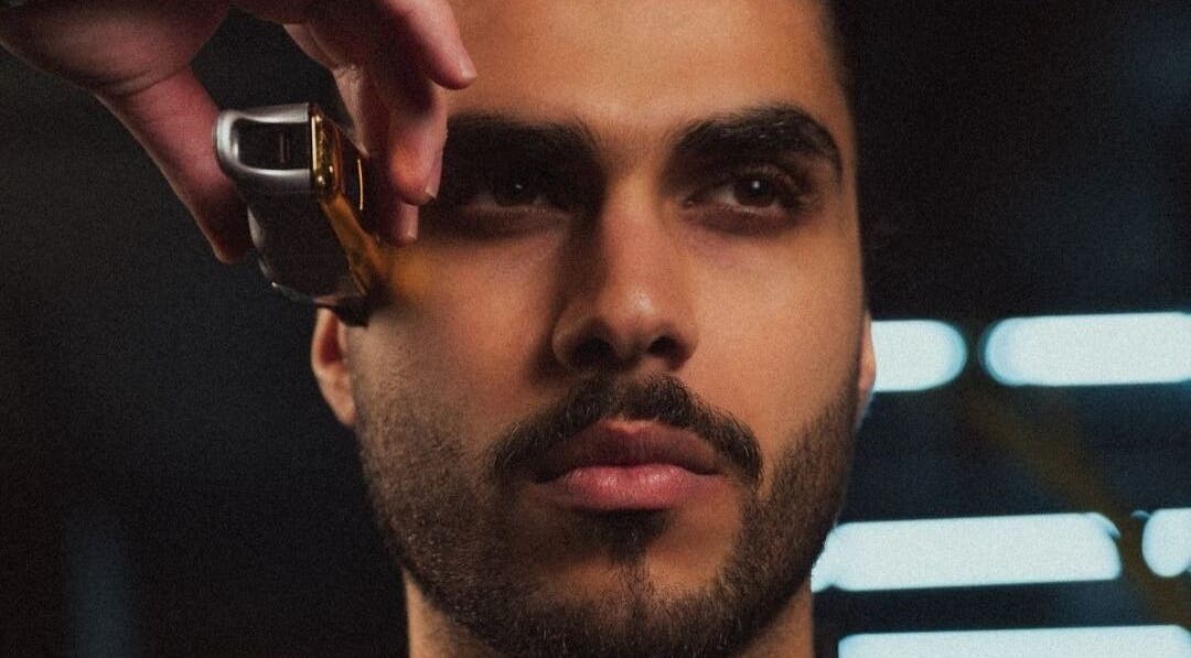 Close-up of a man receiving a stylish haircut at Yousef Afandi-7th Circle, Amman, Amman Governorate, JO.