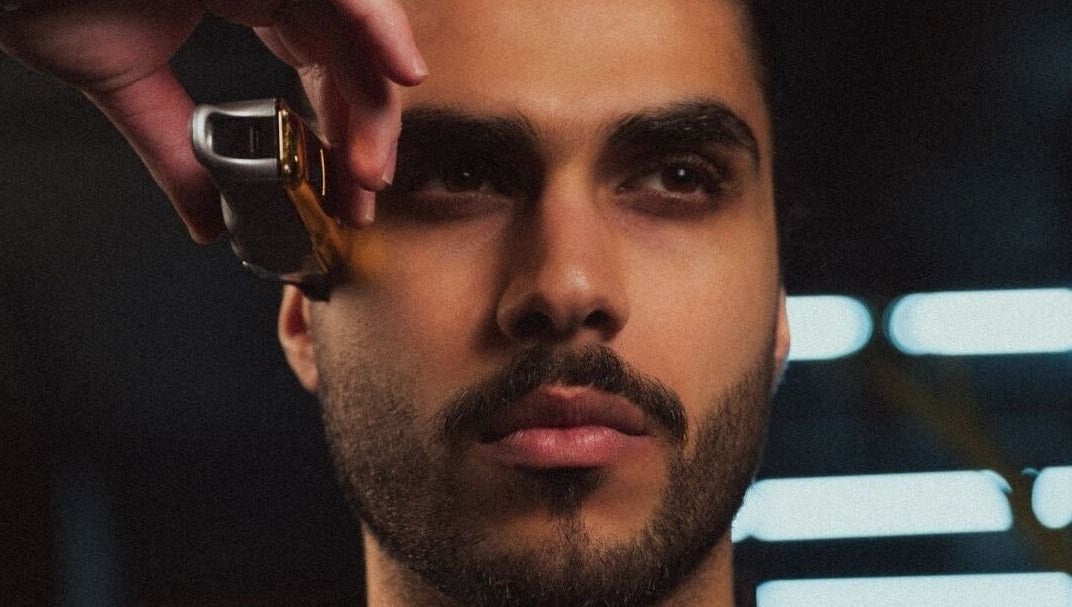 Professional barber trimming hair at Yousef Afandi Express-Sports City, Amman, Amman Governorate, JO.