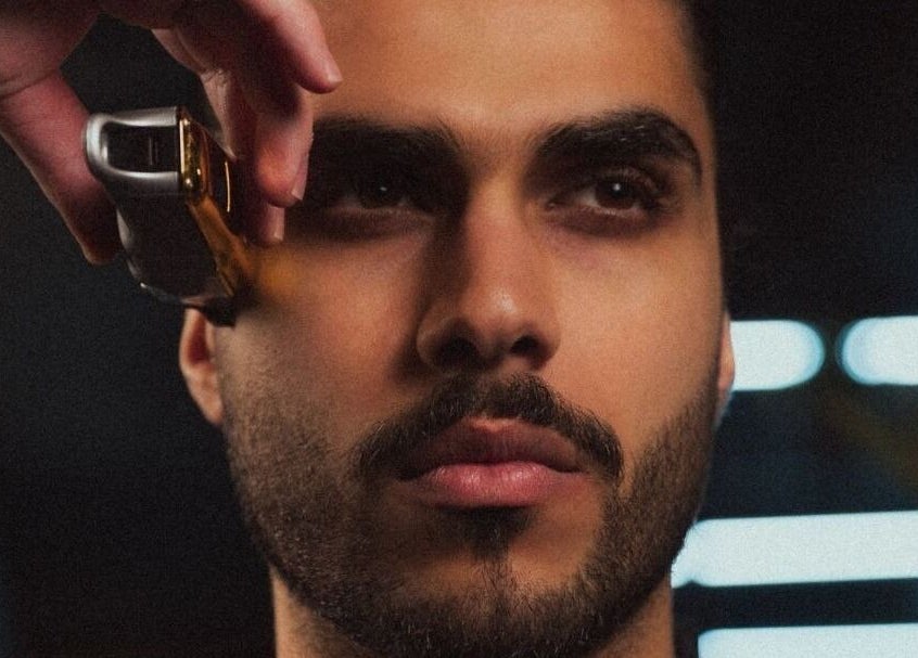 Professional barber trimming hair at Yousef Afandi Express-Sports City, Amman, Amman Governorate, JO.