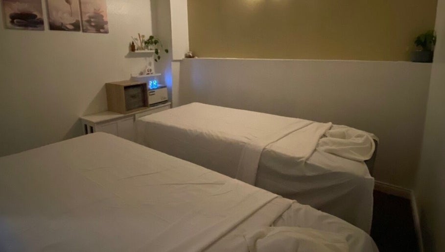 Tranquil massage room at Organic Thai Massage, Spa and Facial, Torrance, California, US with two relaxing beds.