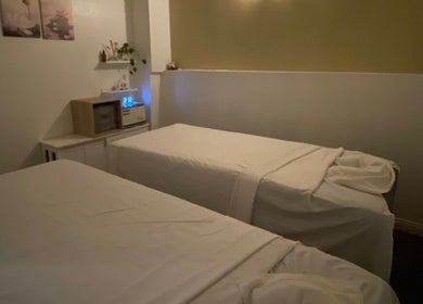Tranquil massage room at Organic Thai Massage, Spa and Facial, Torrance, California, US with two relaxing beds.