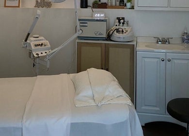 Spa treatment room at Organic Thai Massage, Spa and Facial in Torrance, California, US, showcasing a massage table.