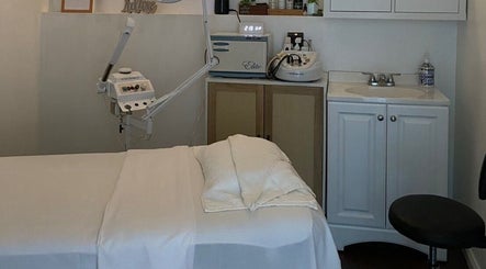 Spa treatment room at Organic Thai Massage, Spa and Facial in Torrance, California, US, showcasing a massage table.
