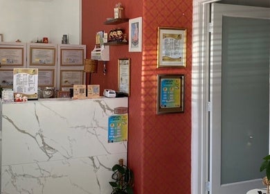 Reception area of Organic Thai Massage, Spa and Facial in Torrance, California with traditional decor and welcome desk.
