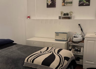 Tranquil treatment room at Organic Thai Massage, Spa and Facial in Torrance, California, US, featuring cozy amenities.
