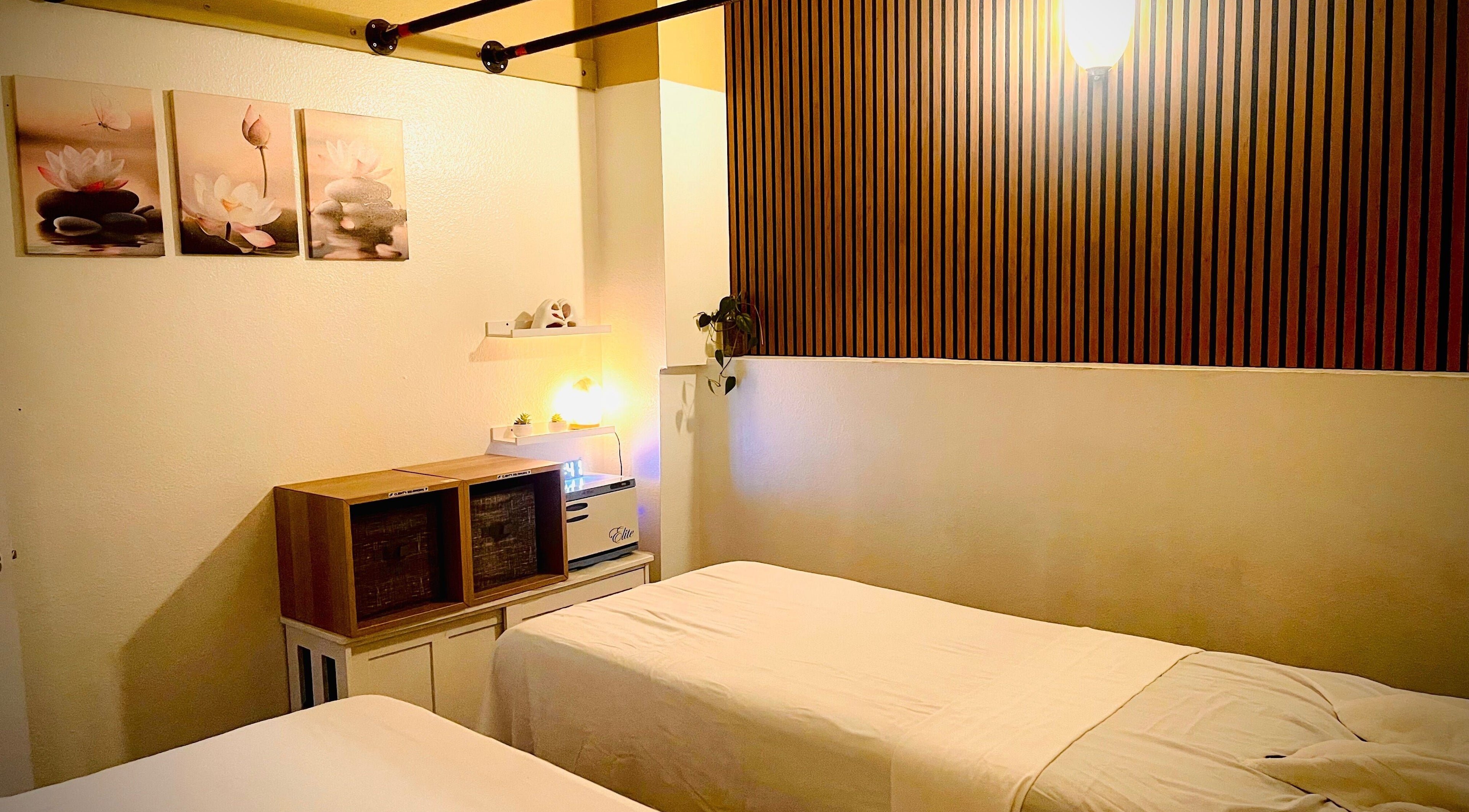 Serene massage room at Organic Thai Massage, Spa and Facial, Torrance, California, US with calming decor.