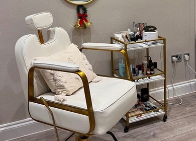 Luxurious beauty chair at Connect Beauty in Brighton, England, GB, next to a trolley with beauty products.