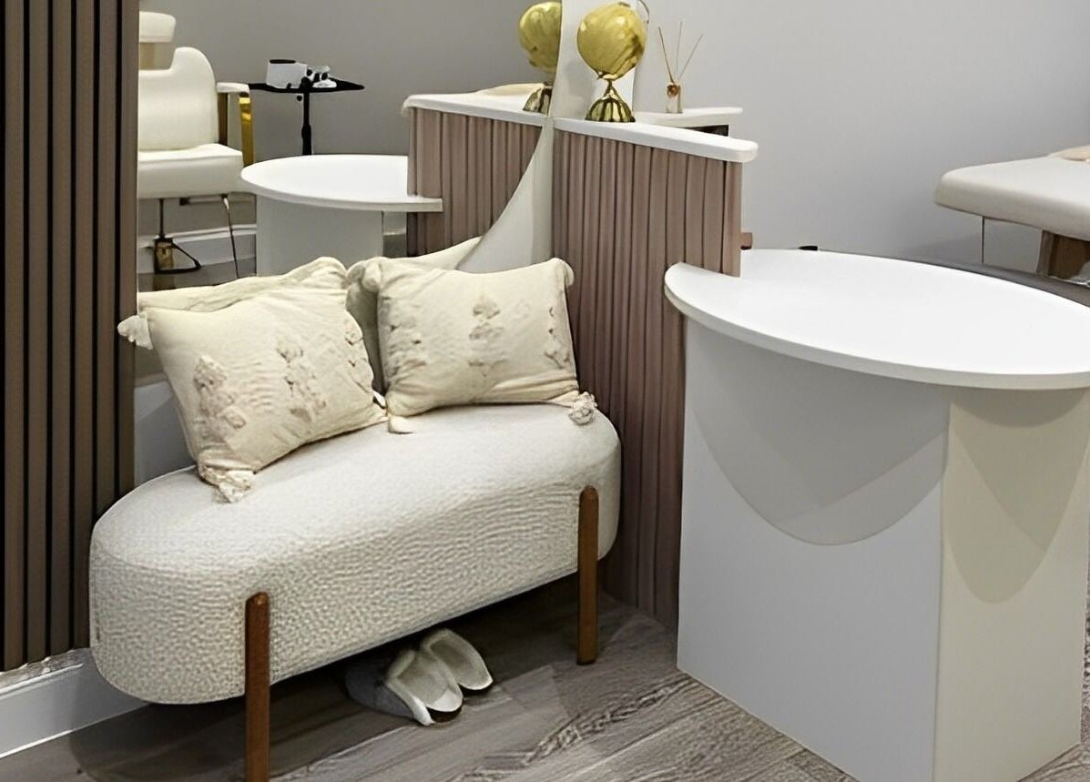 Chic seating in beauty room at Connect Beauty, Brighton, England, GB, featuring plush cushions and modern decor.