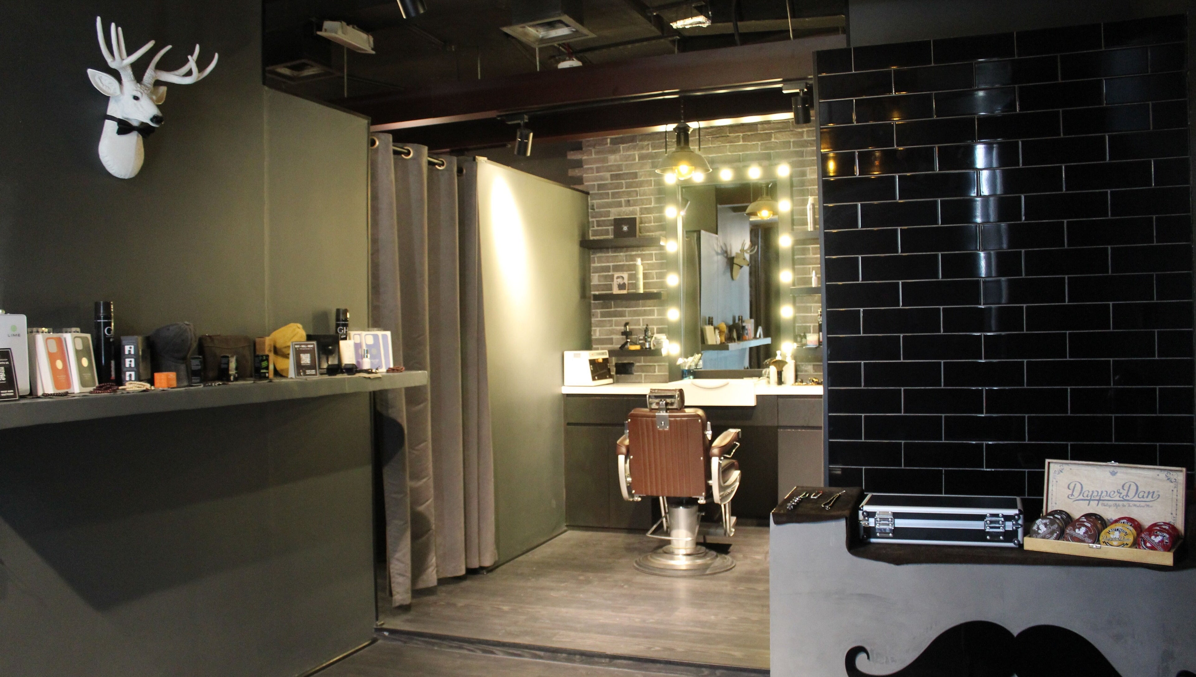 Inside Musk Barbershop JVC in Dubai, Dubai, AE showcasing a chic grooming station and modern decor.