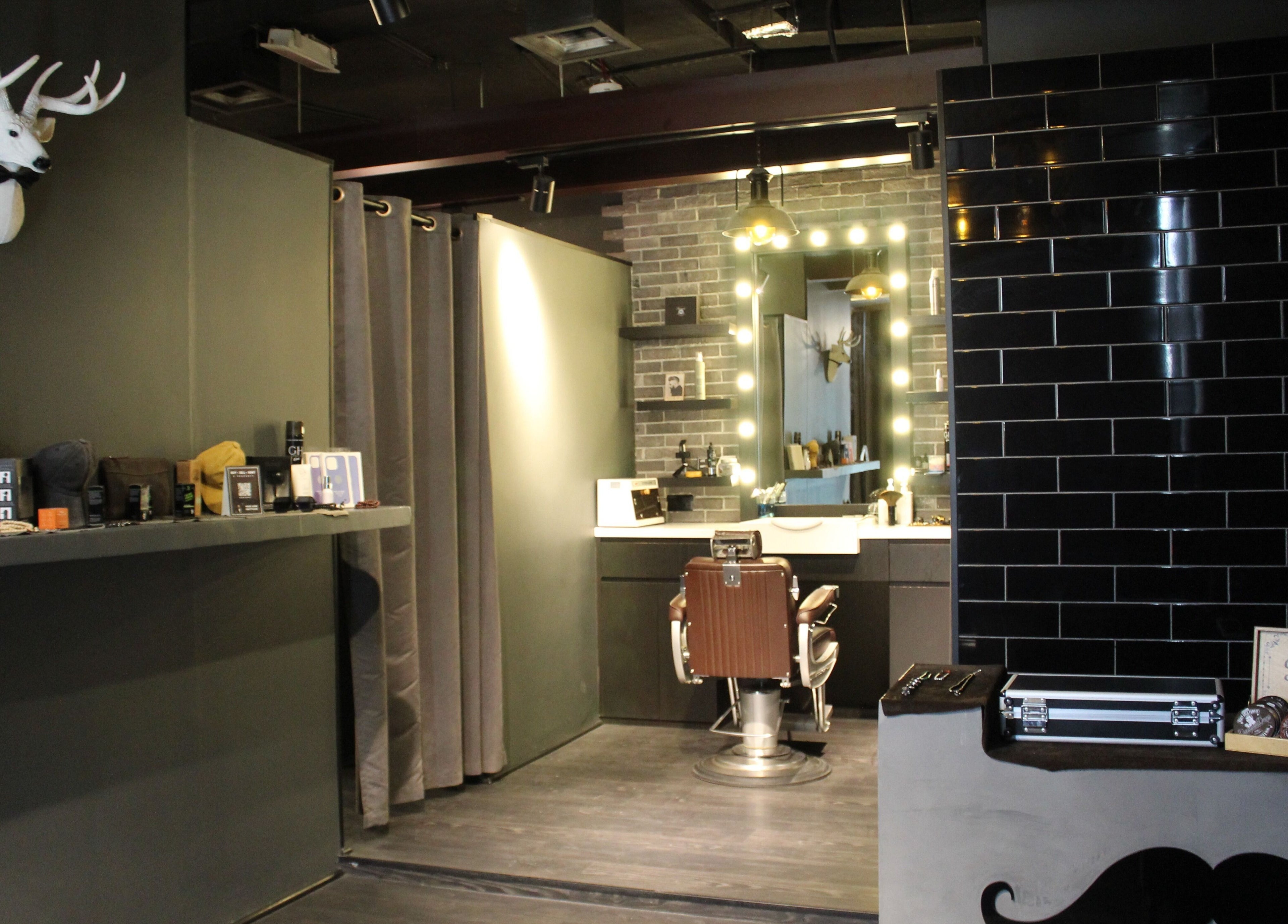 Inside Musk Barbershop JVC in Dubai, Dubai, AE showcasing a chic grooming station and modern decor.