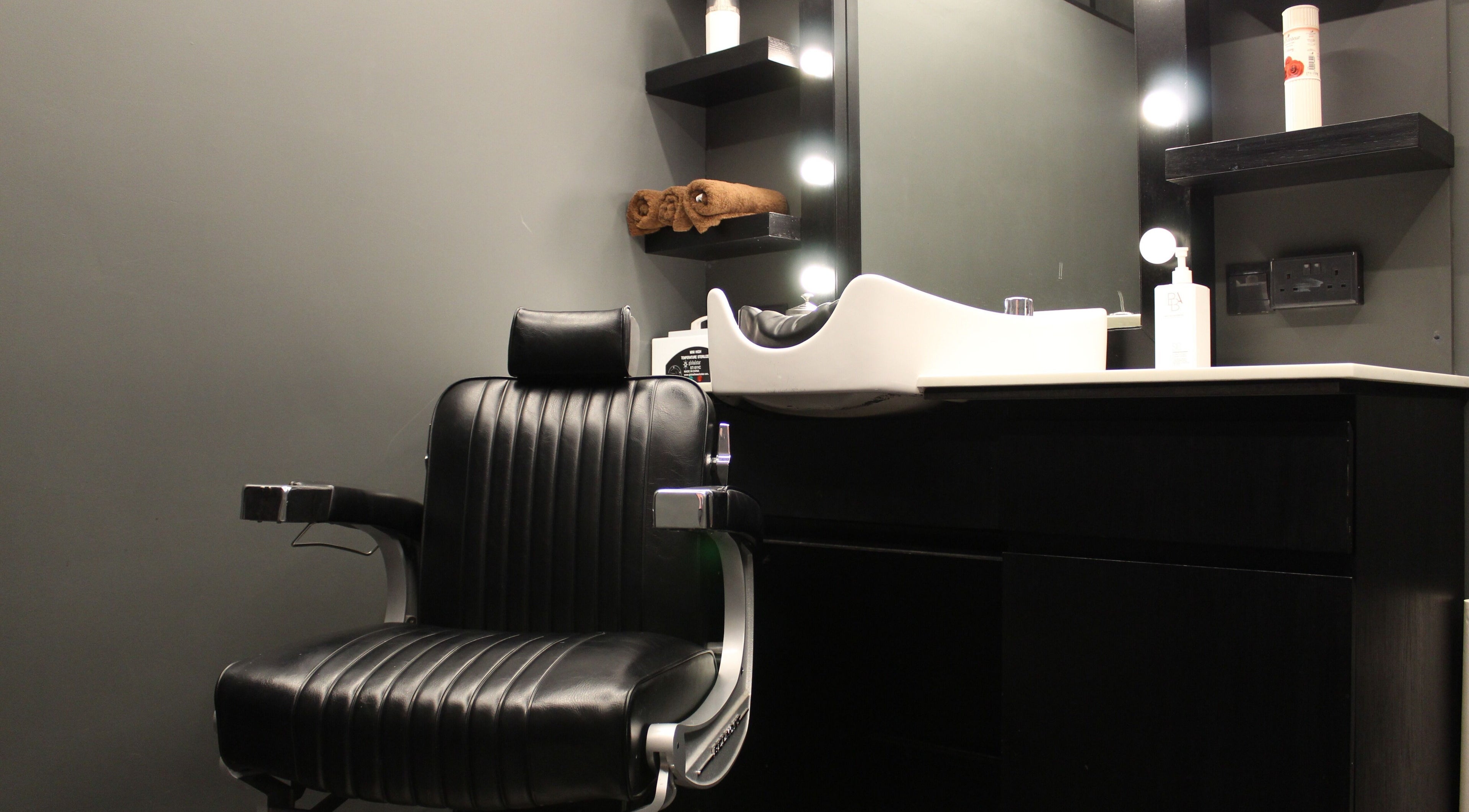 Modern barber chair and sink at Musk Barbershop JVC, Dubai, Dubai, AE, offering a premium grooming experience.