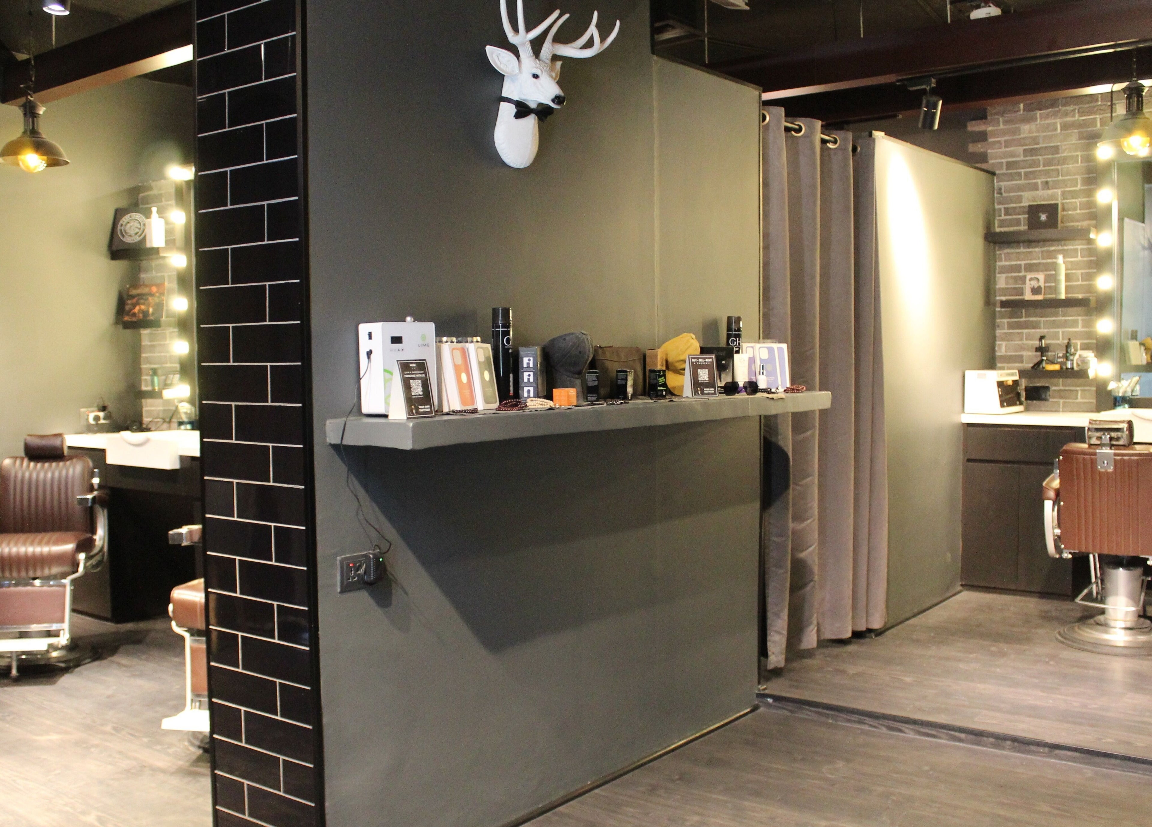 Modern interior of Musk Barbershop JVC, Dubai, Dubai, AE with sleek design and styling chairs.