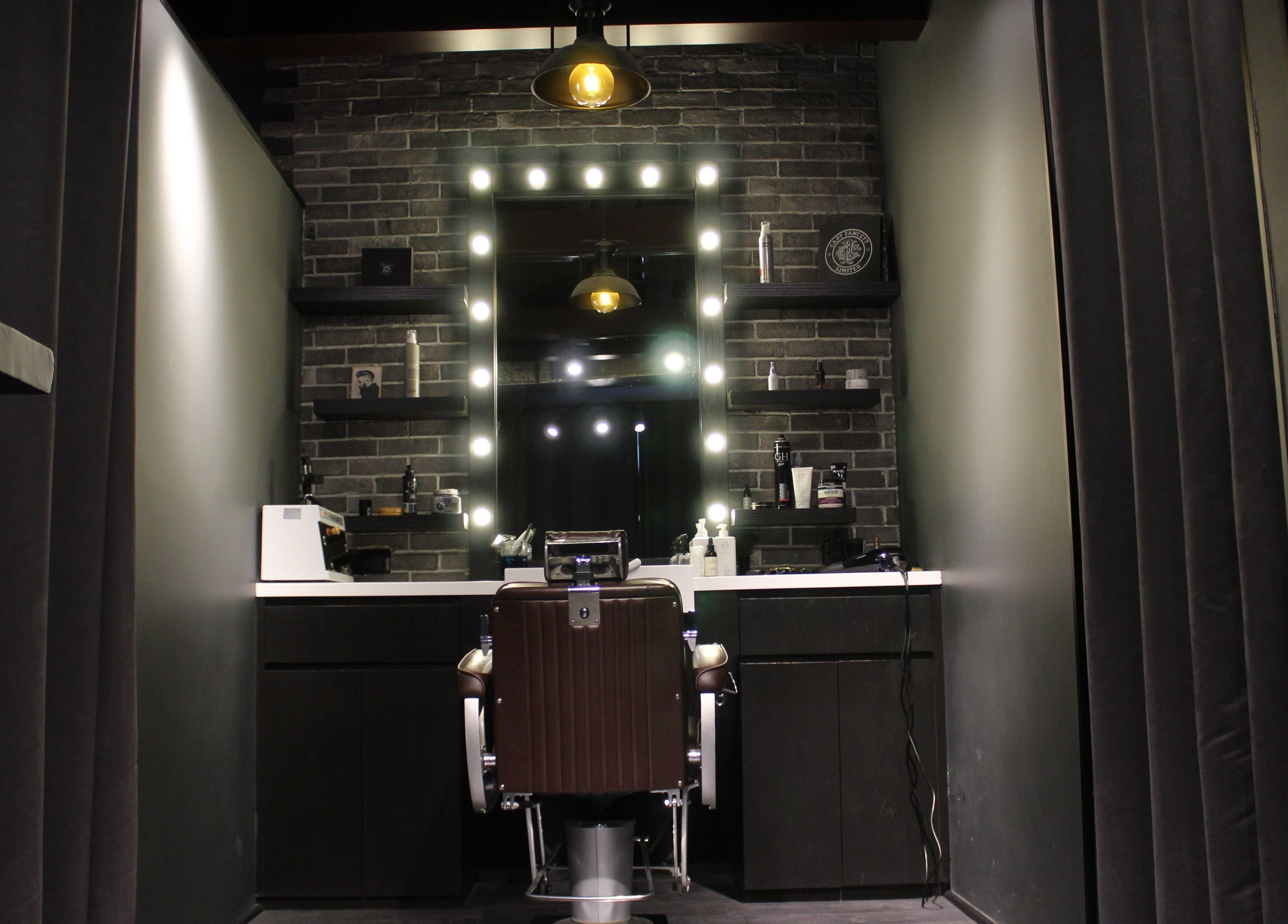 Luxurious barber chair at Musk Barbershop JVC, Dubai, Dubai, AE, with elegant lighting and decor.
