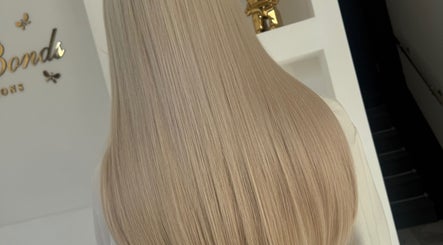 Long, straight blonde hair at BellaBonds Hair Extensions in Tynemouth, England, GB showcasing elegant style.
