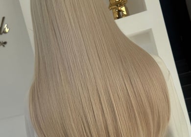Long, silky blonde hair extensions at BellaBonds Hair Extensions, Tynemouth, England, GB.