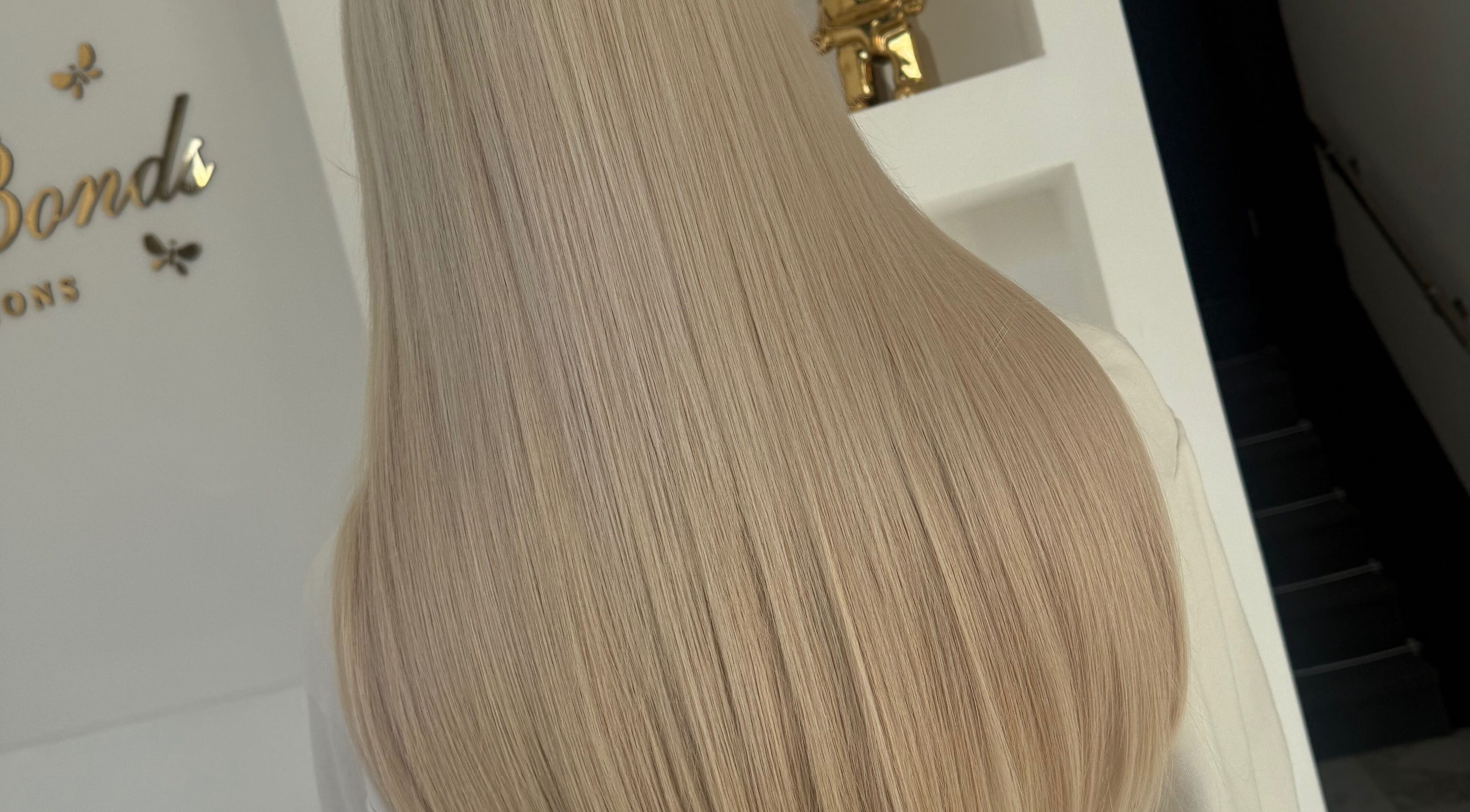 Long, silky blonde hair extensions at BellaBonds Hair Extensions, Tynemouth, England, GB.