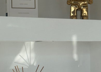 Stylish shelf with a golden ornament at BellaBonds Hair Extensions, Tynemouth, England, GB.