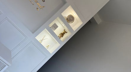 Chic interior decor of BellaBonds Hair Extensions, Tynemouth, England, GB showcasing stylish wall shelving.