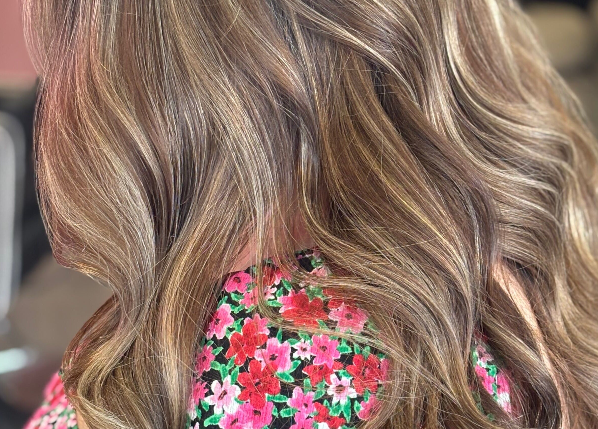 Stylish wavy hair with subtle highlights at Emily Sinclair Hair, Congleton, England, GB.