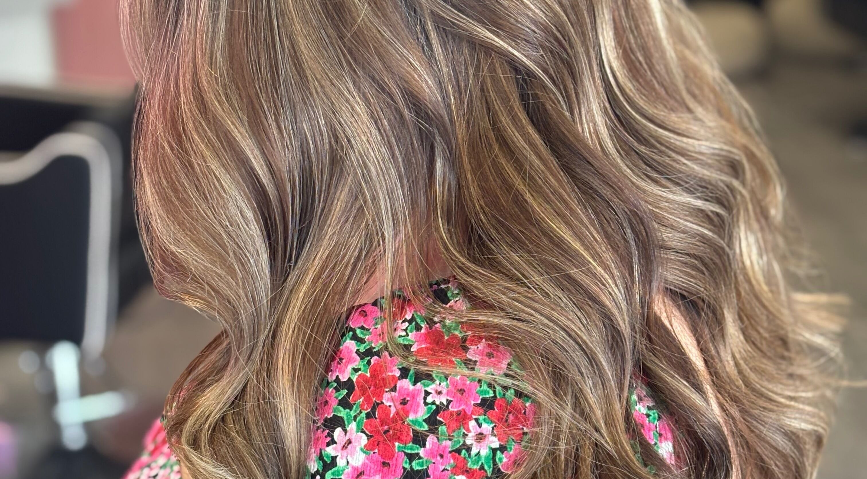 Stylish wavy hair with subtle highlights at Emily Sinclair Hair, Congleton, England, GB.