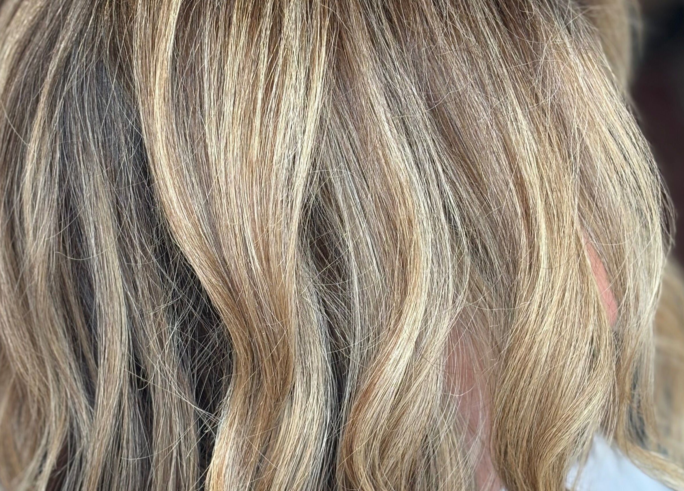 Blonde wavy hairstyle at Emily Sinclair Hair in Congleton, England, GB, showcasing expert coloring.