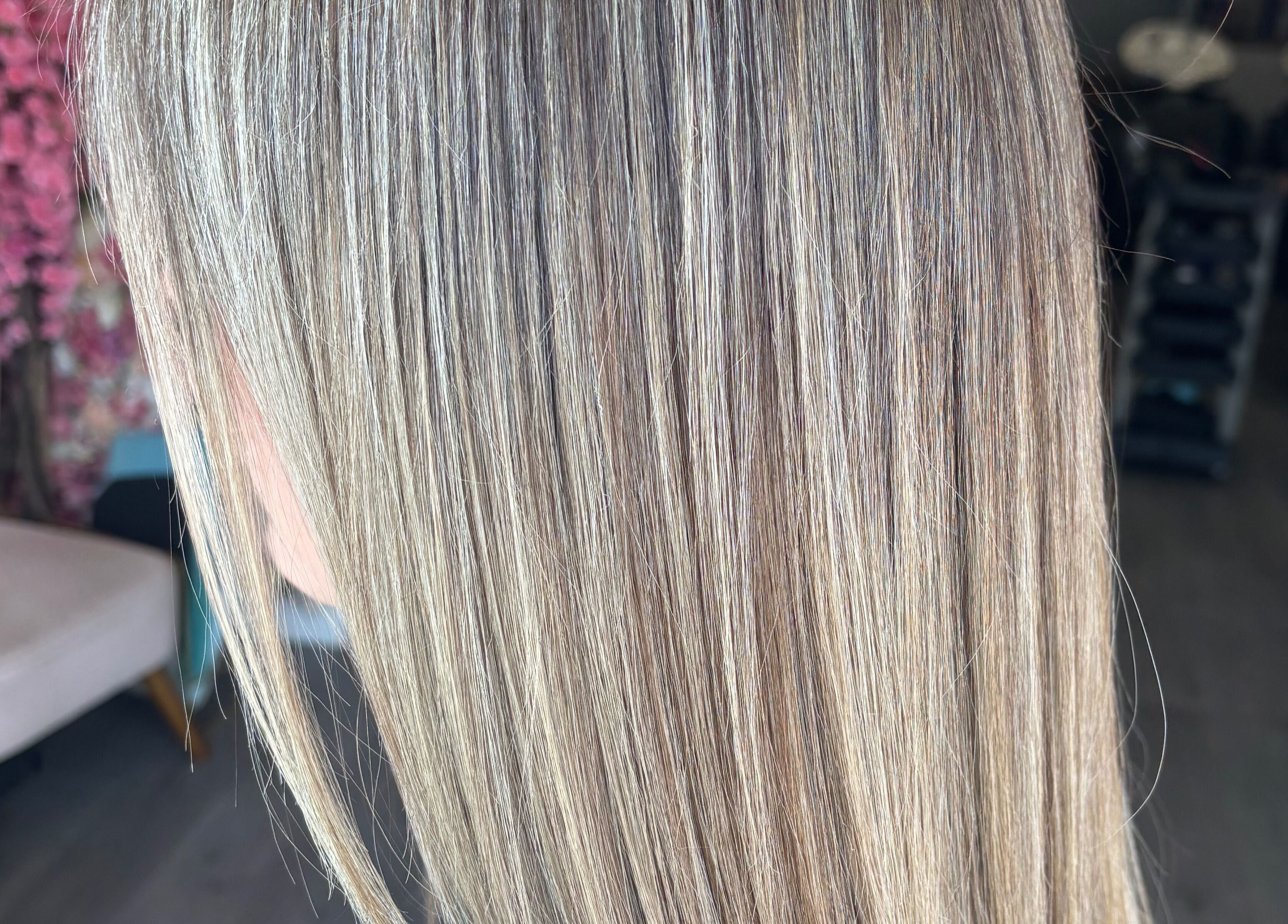 Smooth, silky blonde hair at Emily Sinclair Hair, Congleton, England, GB, enhancing natural beauty.