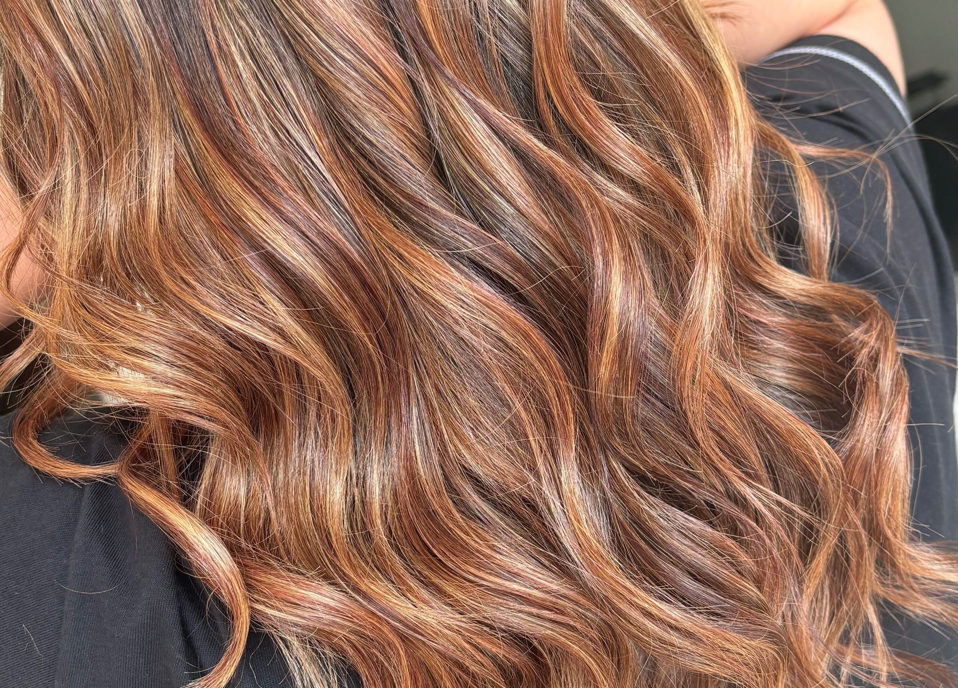 Wavy, highlighted hair styled at Emily Sinclair Hair in Congleton, England, GB.