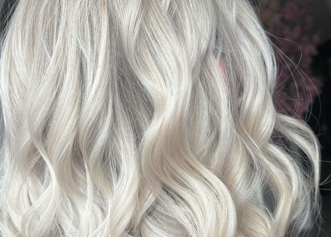 Luxurious blonde waves styled at Emily Sinclair Hair in Congleton, England, GB, showcasing expert hair techniques.