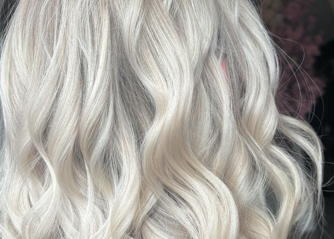 Luxurious blonde waves styled at Emily Sinclair Hair in Congleton, England, GB, showcasing expert hair techniques.