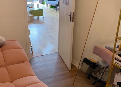 Serene treatment room at Lash by Daria, London, England, GB, with plush seating and calming decor.