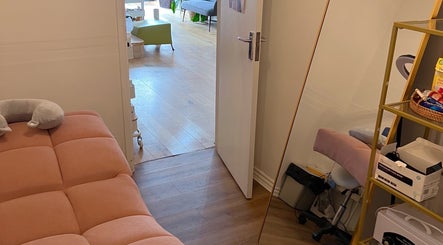 Serene treatment room at Lash by Daria, London, England, GB, with plush seating and calming decor.