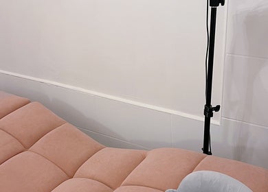 Cozy peach treatment bed at Lash by Daria, London, England, GB, offering a relaxing beauty experience.