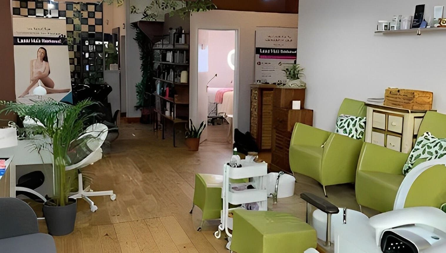 Welcoming interior of Lash by Daria in London, England, GB. Modern chairs and plants create a serene ambiance.