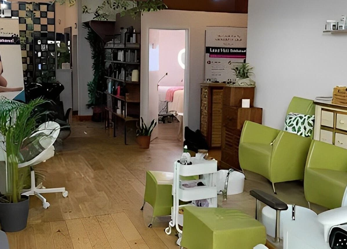 Welcoming interior of Lash by Daria in London, England, GB. Modern chairs and plants create a serene ambiance.