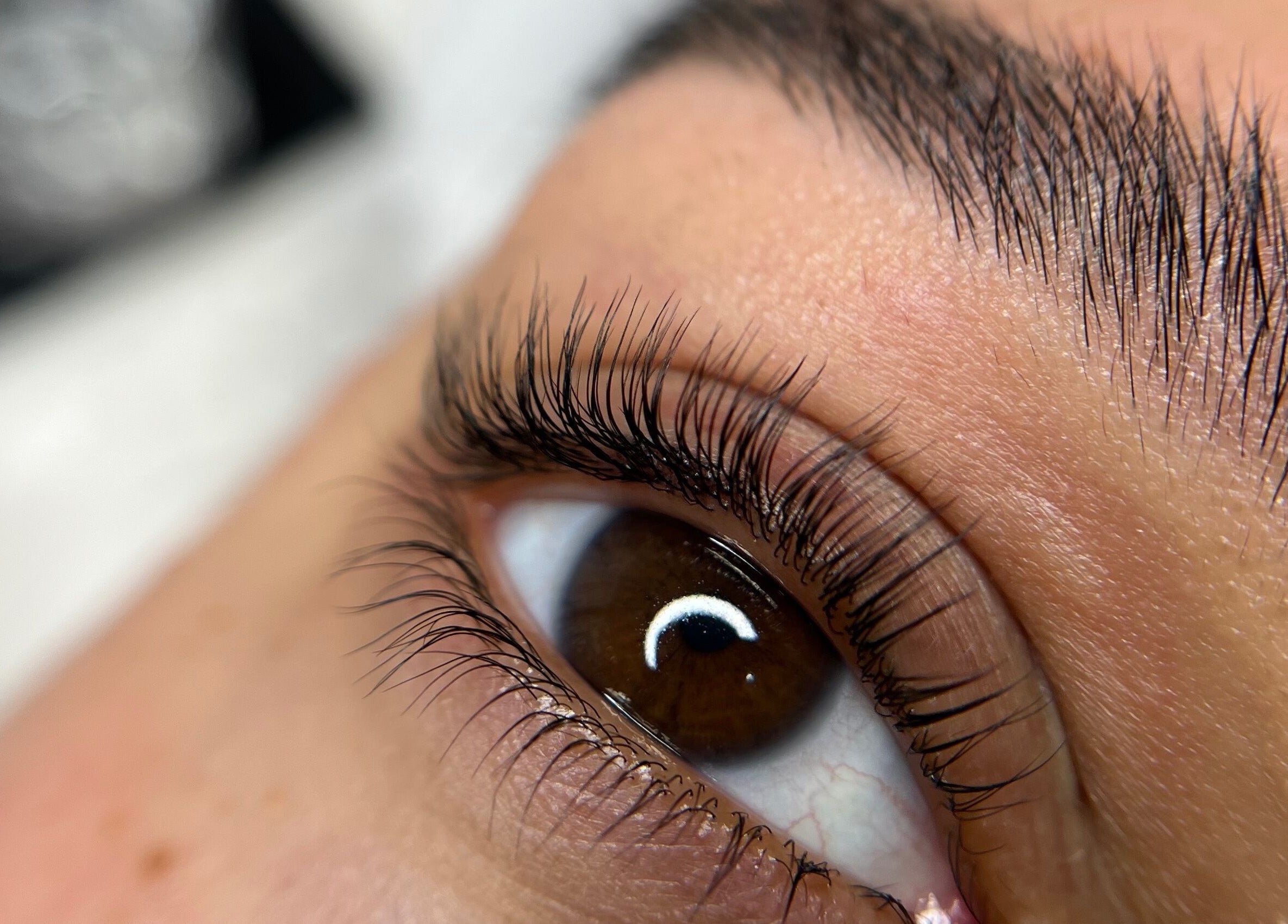 Close-up of enhanced eyelashes at Lash by Daria, London, England, GB showcasing detailed beauty work.