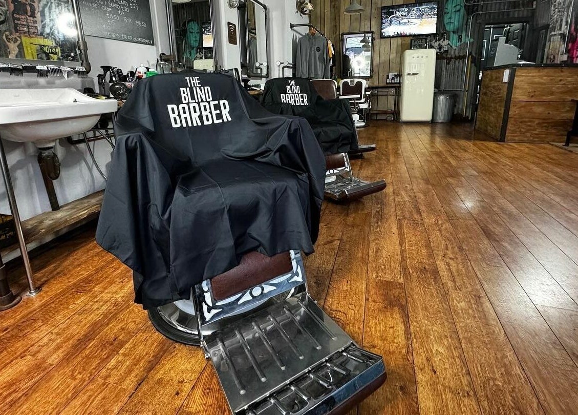 Stylish salon chairs at The Blind Barber Leigh-On-Sea in Southend-on-Sea, England, GB with modern decor.