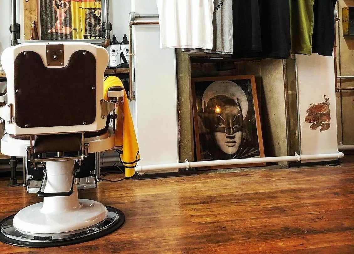 Retro barber chair at The Blind Barber Leigh-On-Sea, Southend-on-Sea, England, GB, highlighting unique decor.