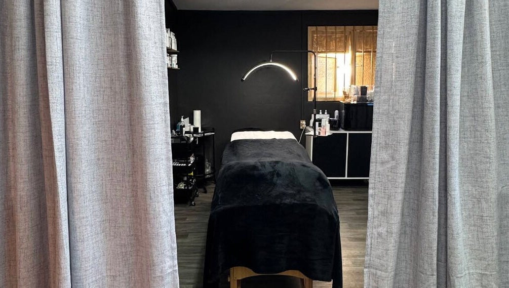 Relaxing treatment room at StudioEDIT, Kawakawa, Northland, NZ, with luxurious massage table and ambient lighting.