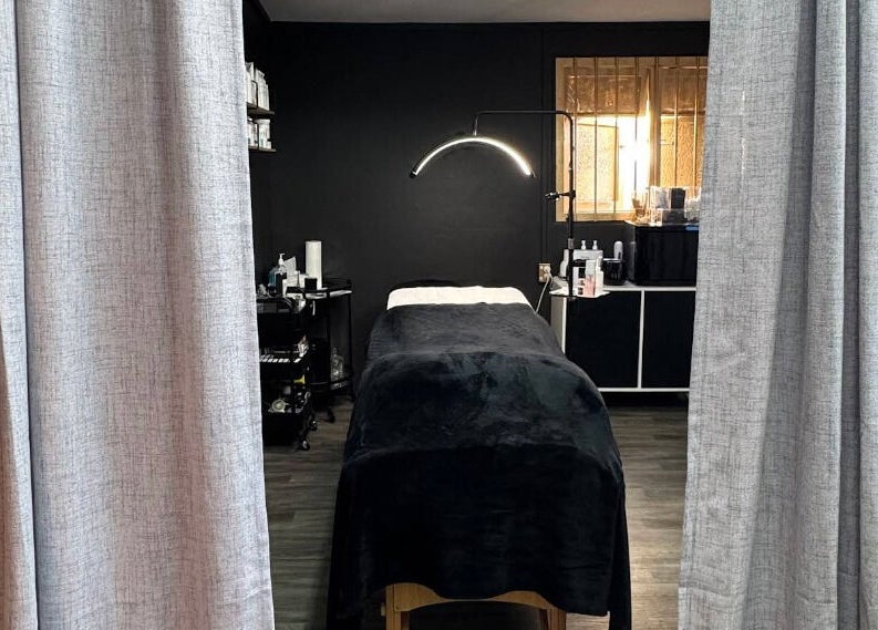 Relaxing treatment room at StudioEDIT, Kawakawa, Northland, NZ, with luxurious massage table and ambient lighting.