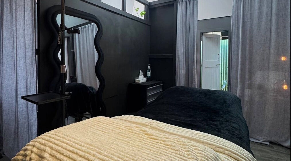 Cozy treatment room at StudioEDIT in Kawakawa, Northland, NZ featuring plush bedding and relaxing ambiance.